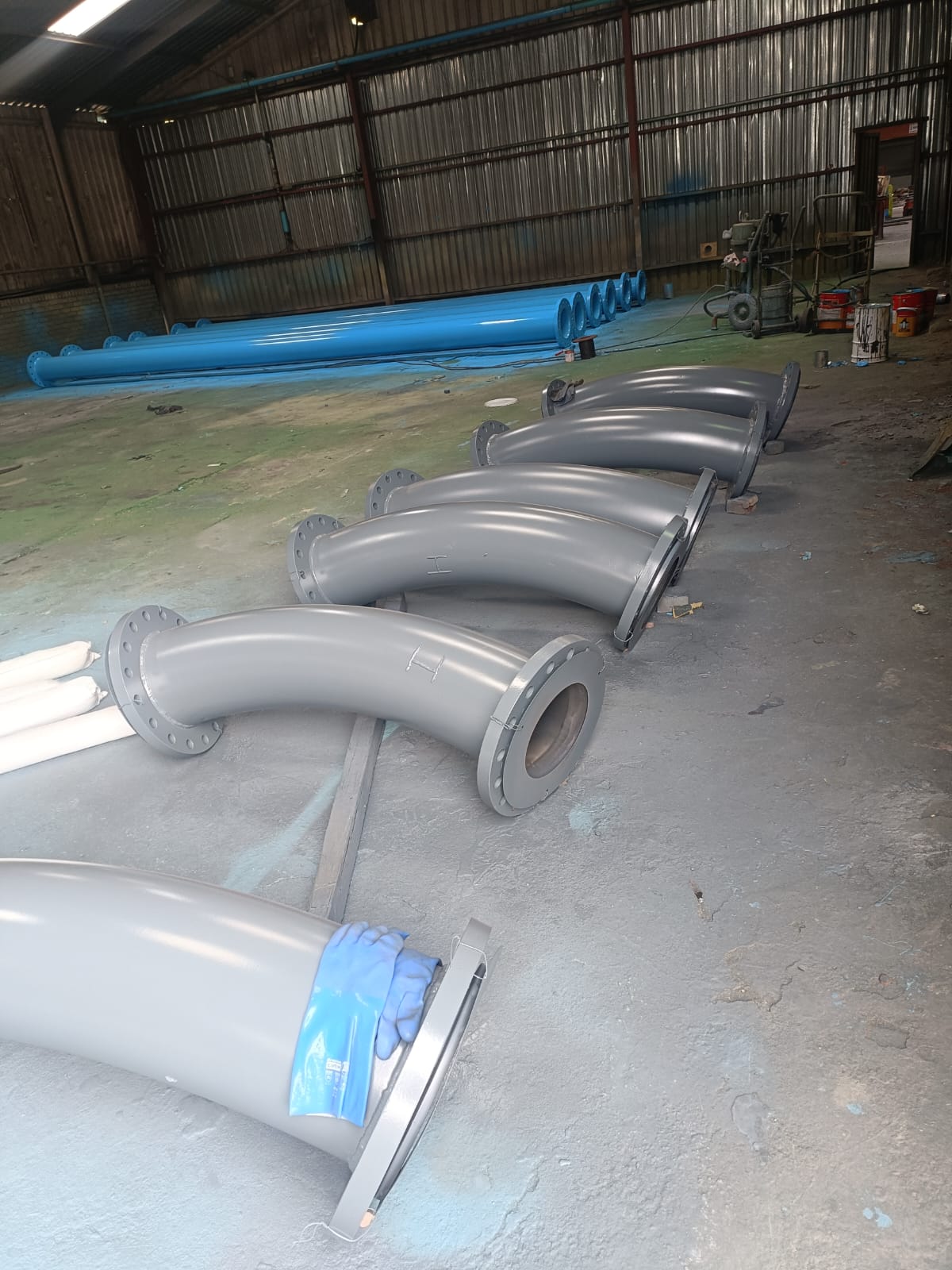 Coated flanged steel pipe bends fabricated in the Wetpipe workshop