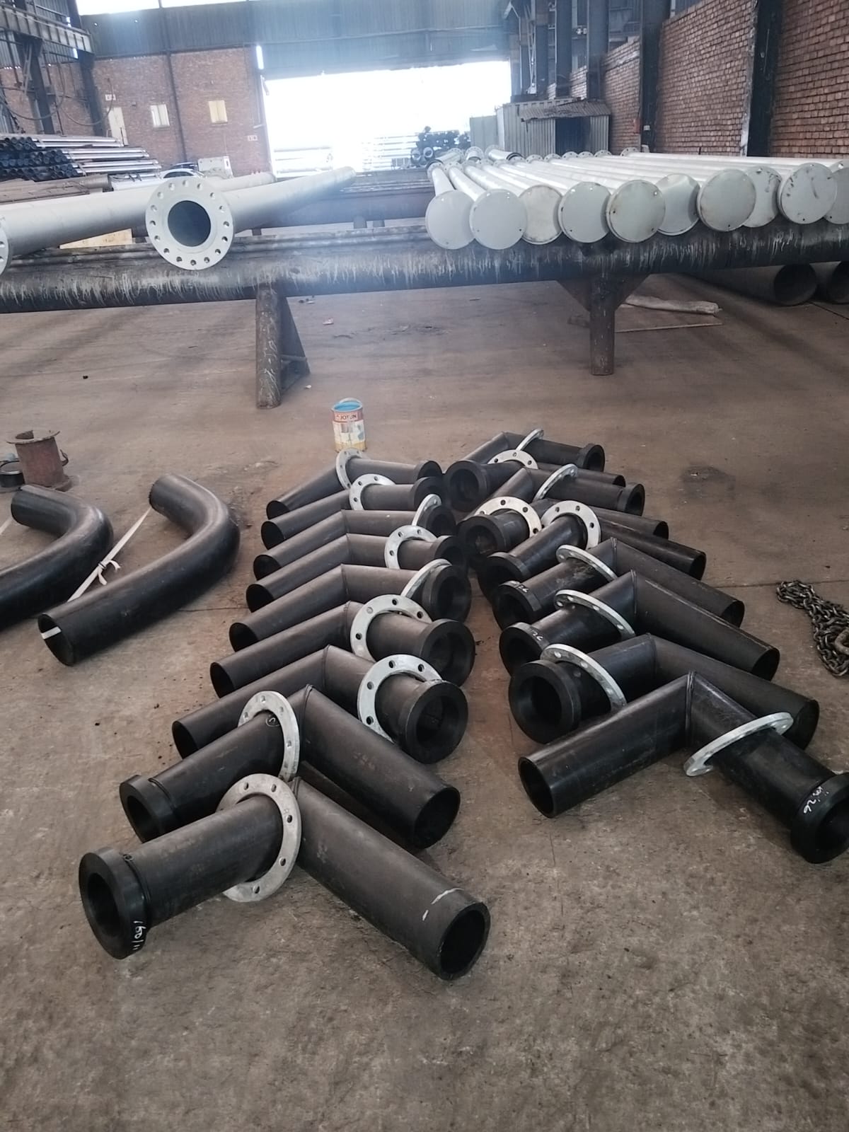 HDPE slurry tees with steel backing flanges staged in the Wetpipe workshop